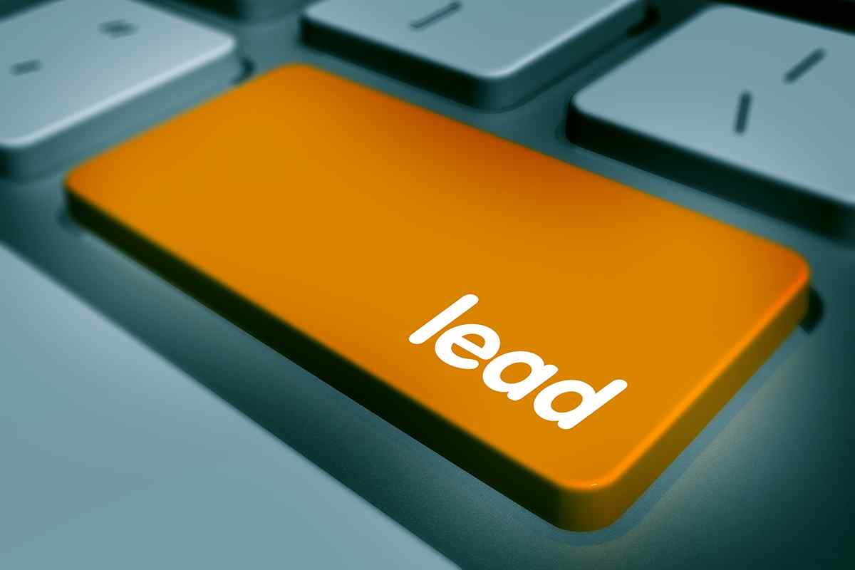 Close-up of a keyboard with an orange key labeled "lead."