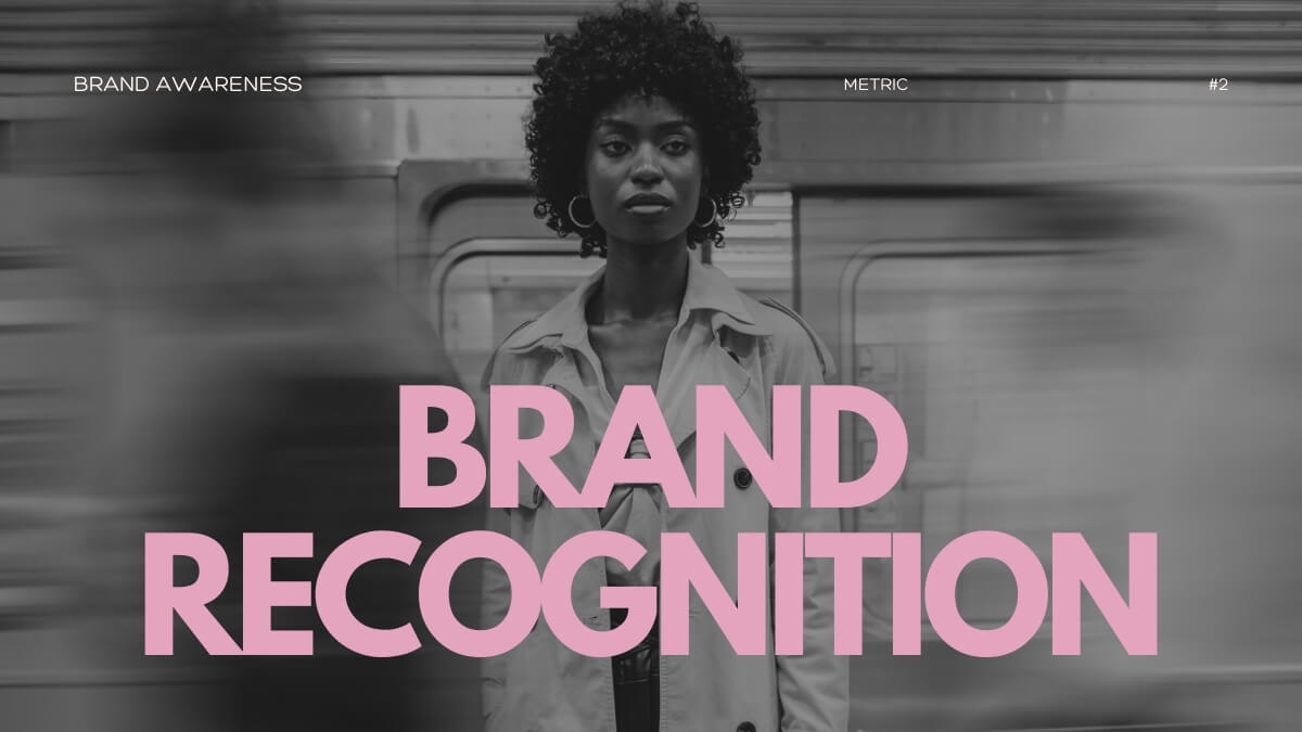 Black and white photo of a woman with curly hair standing in front of a blurred subway, with "Brand Recognition" text overlay. Brand recognition is one of the main brand awareness kpi.