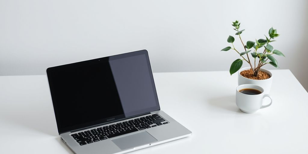 Minimalist workspace with laptop and coffee, symbolizing simplicity - one of 5 key principles of effective digital product design.