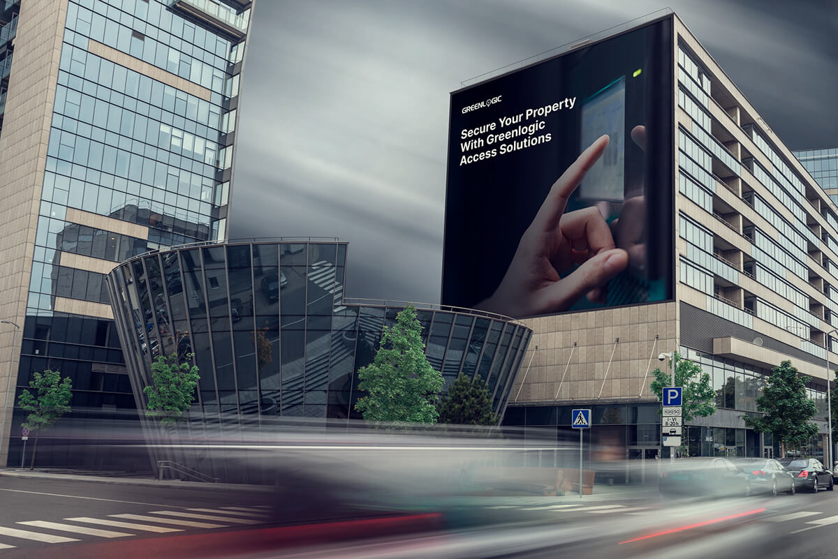 Full-service digital marketing case study: Greenlogic billboard showcasing property security solutions in urban landscape